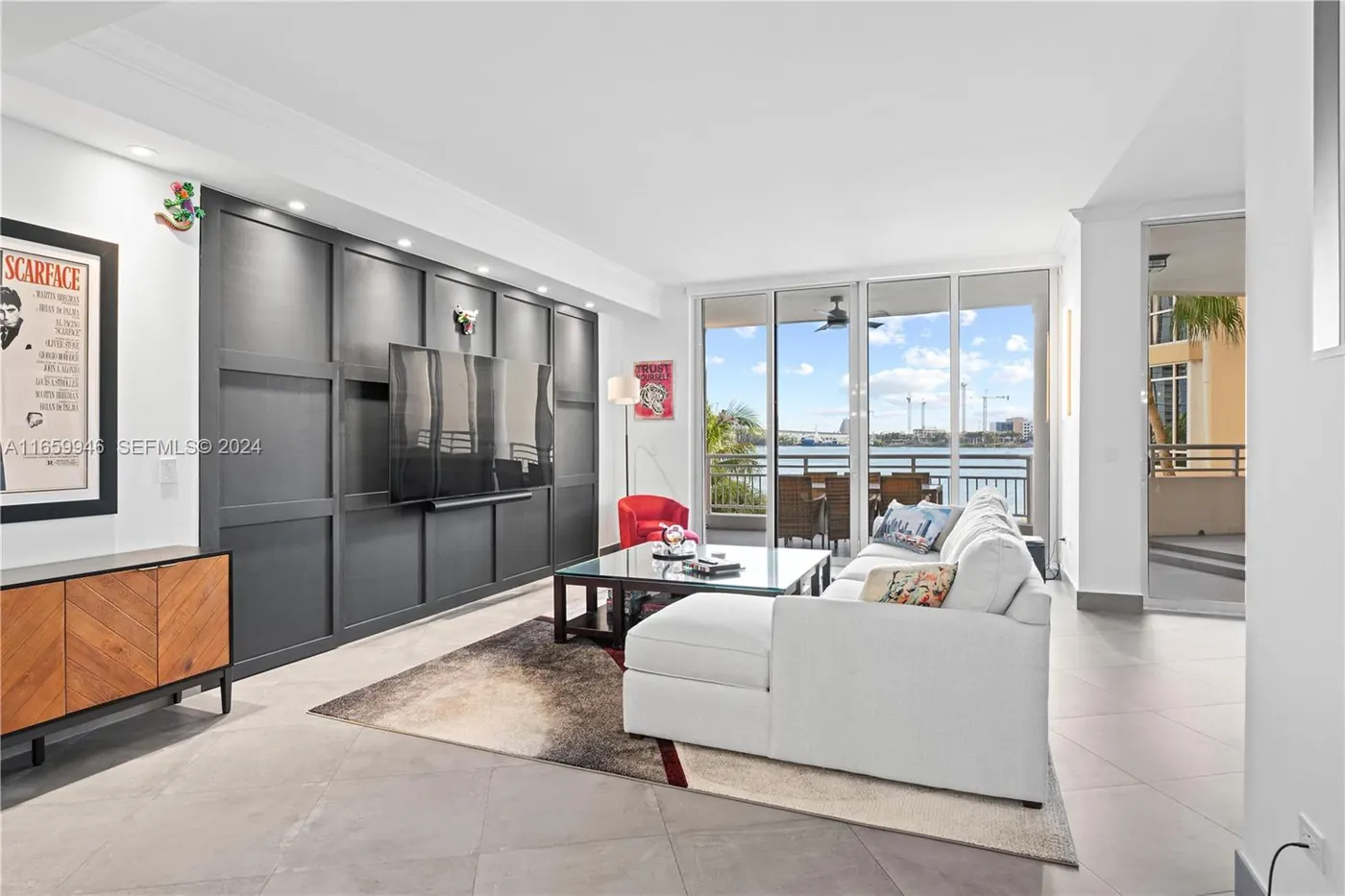 Living room with floor-to-ceiling windows overlooking the water on Brickell Key