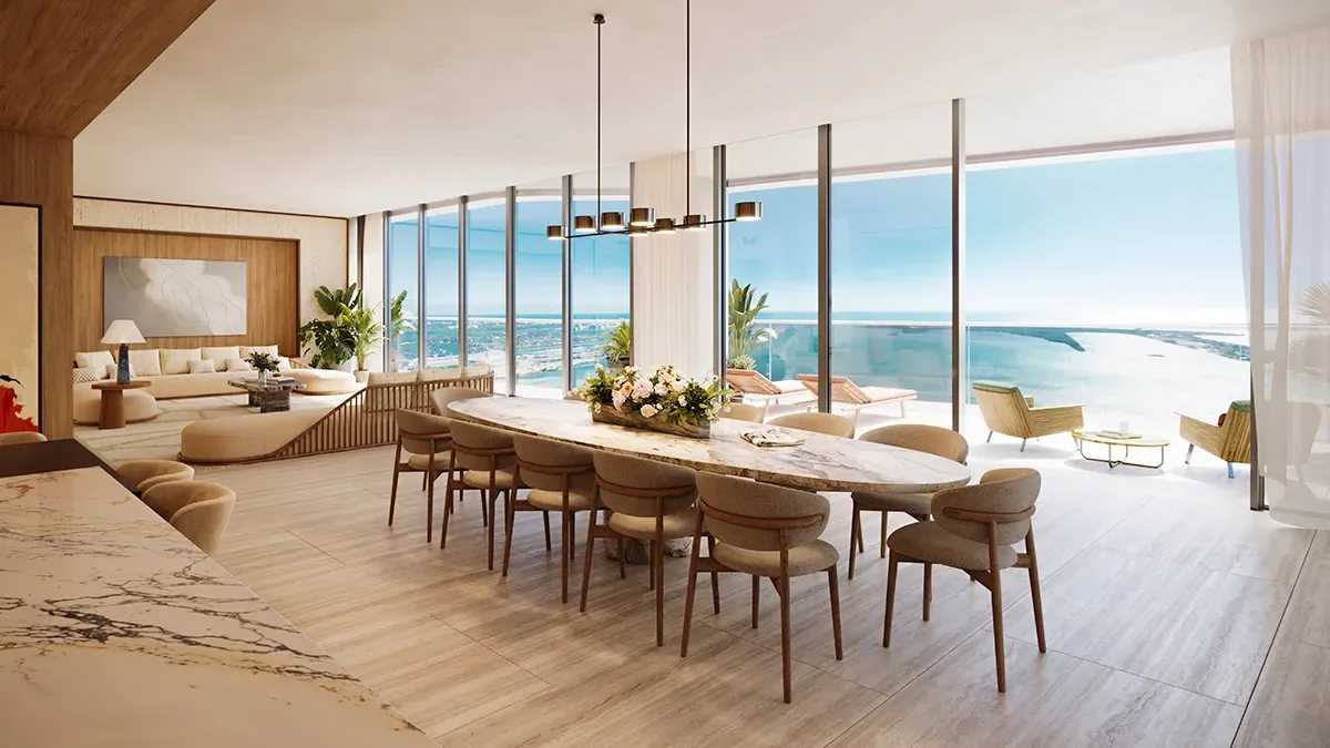 Dining and living room with floor-to-ceiling windows overlooking Biscayne Bay at Mandarin Oriental